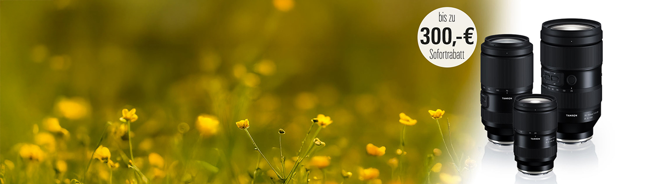 Breites Header-Bild für die Tamron Aktion bei Foto Kücher mit drei Zoom-Objektiven und dem 300 Euro Sofortrabatt-Sticker.